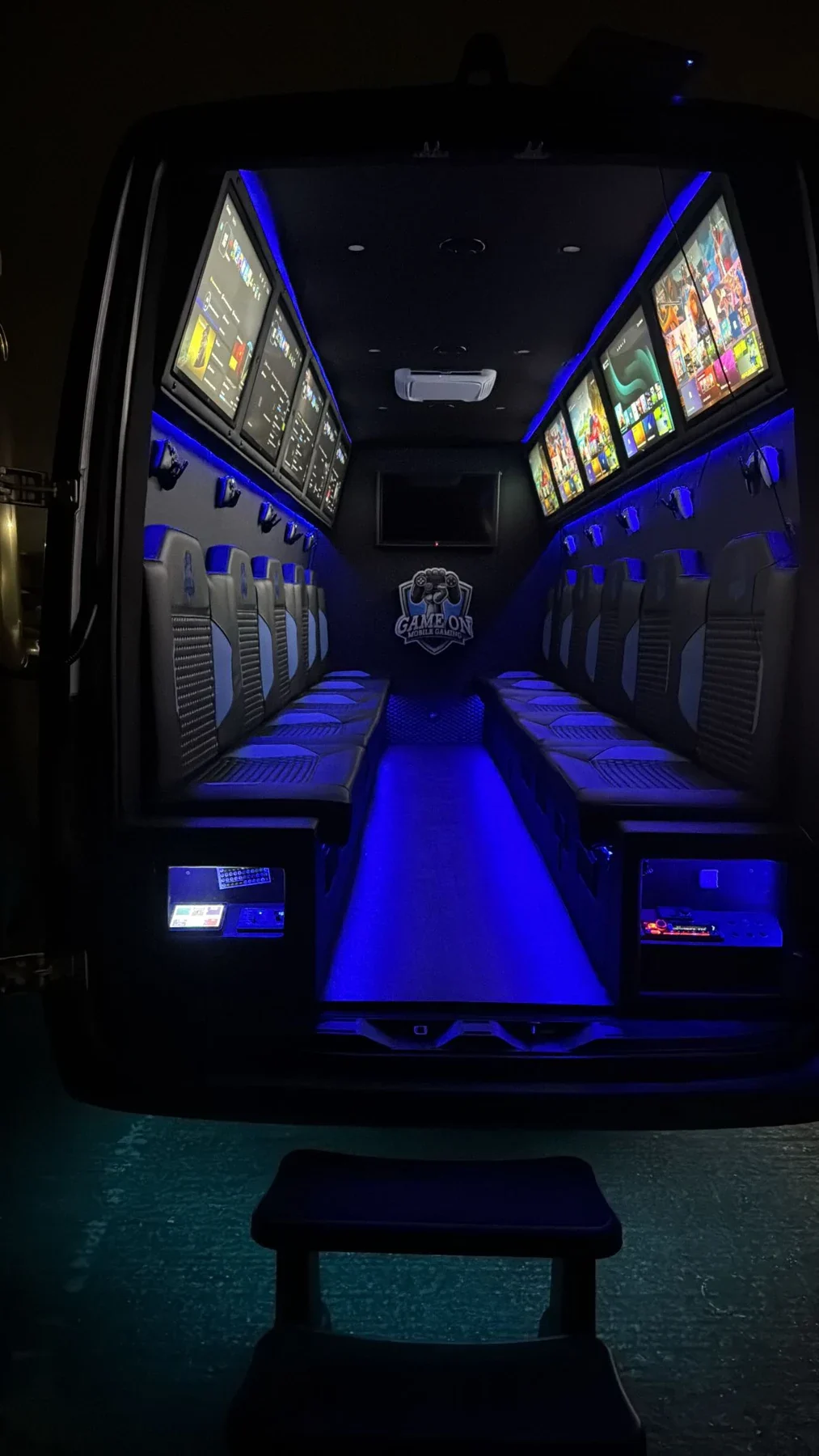 Inside the actual Game On gaming van, showing seats and screens on both sides